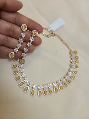 Delicate AD set with yellow crystals in Gold Finish